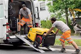 The Kaeser Mobilair M13 portable air compressor being loaded into a van