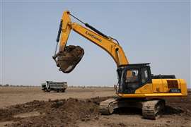 A Liugong excavator working on the site of the new Dholera International Airport in Gujarat in India. (Photo: Reuters)