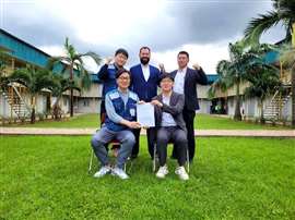 Group of people signing a deal in a compound