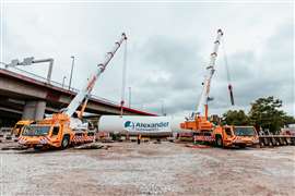 two orange and white Tadano AC 5.160-1 all terrains in the Weiland fleet