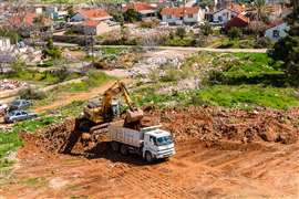 An excavator prepares land for construction in Istanbul, Turkey 