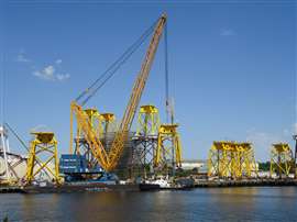 Sarens super heavy lift ring crane assembling transition pieces for offshore turbines