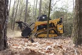 Caterpillar 275 compact track loader with mulcher attachment